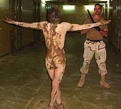 a534_abu_ghraib_detainee_covered_in_feces_fredrick_with_stick_2050081722-7799